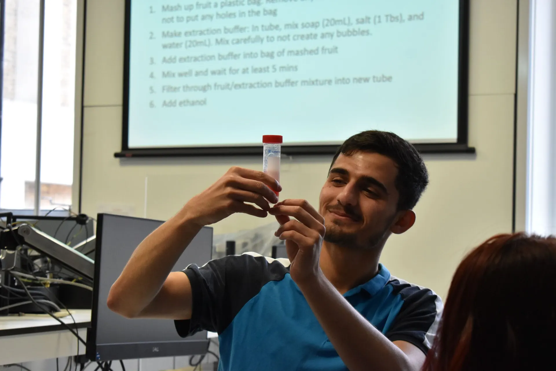 Volunteers and students working together during a workshop
